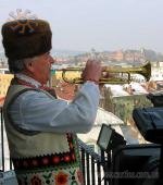 The trumpeter, dressed in folk Ukrainian costume, plays “Marichka” on the clock tower of the City Hall.